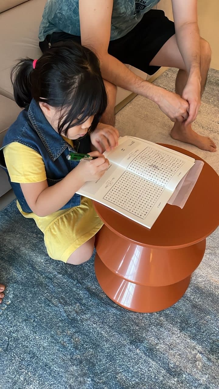 Photo from Fionne: a child enjoying the word search book at home