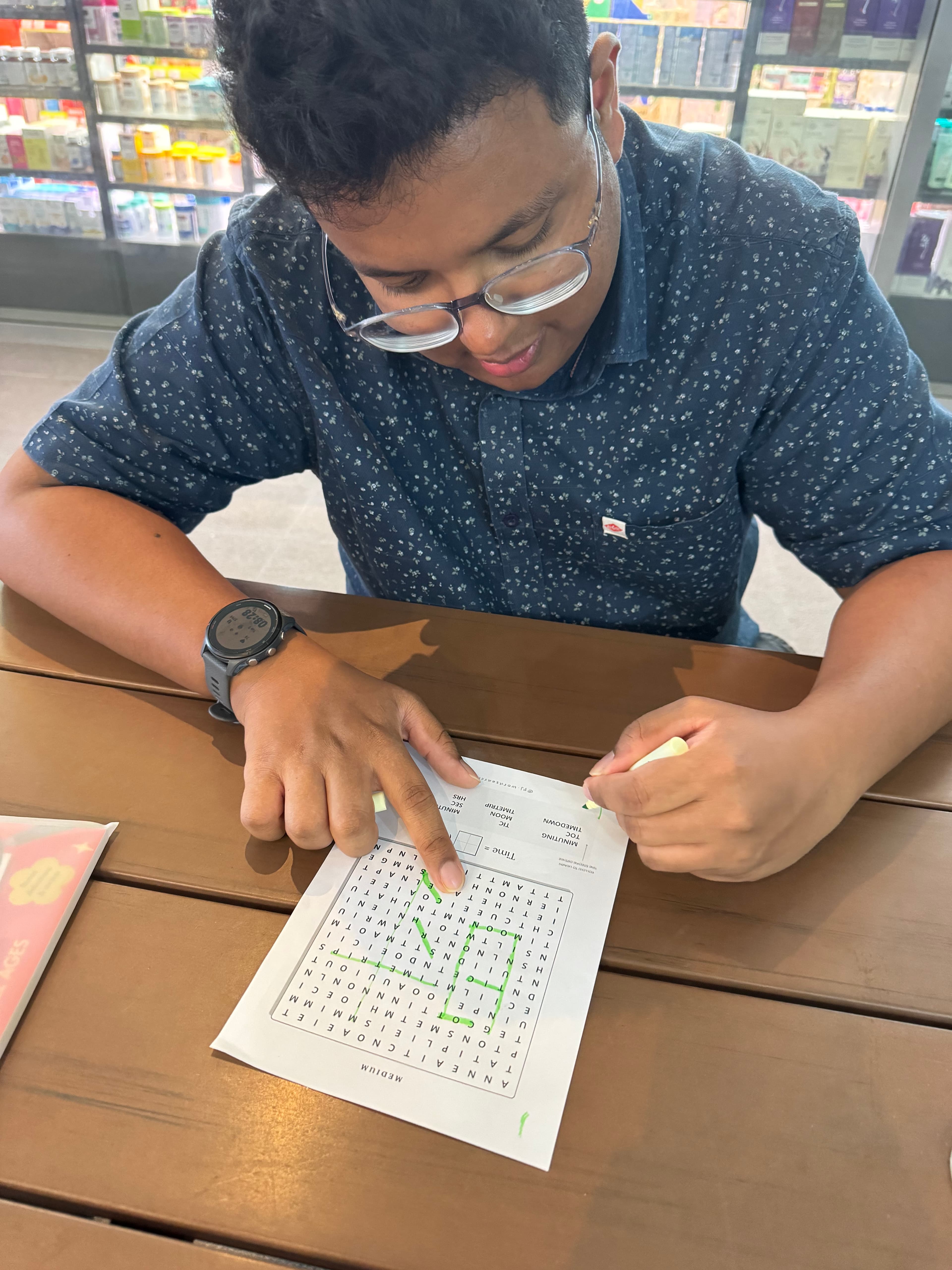 Photo from Vijay: working on a word search puzzle from the book